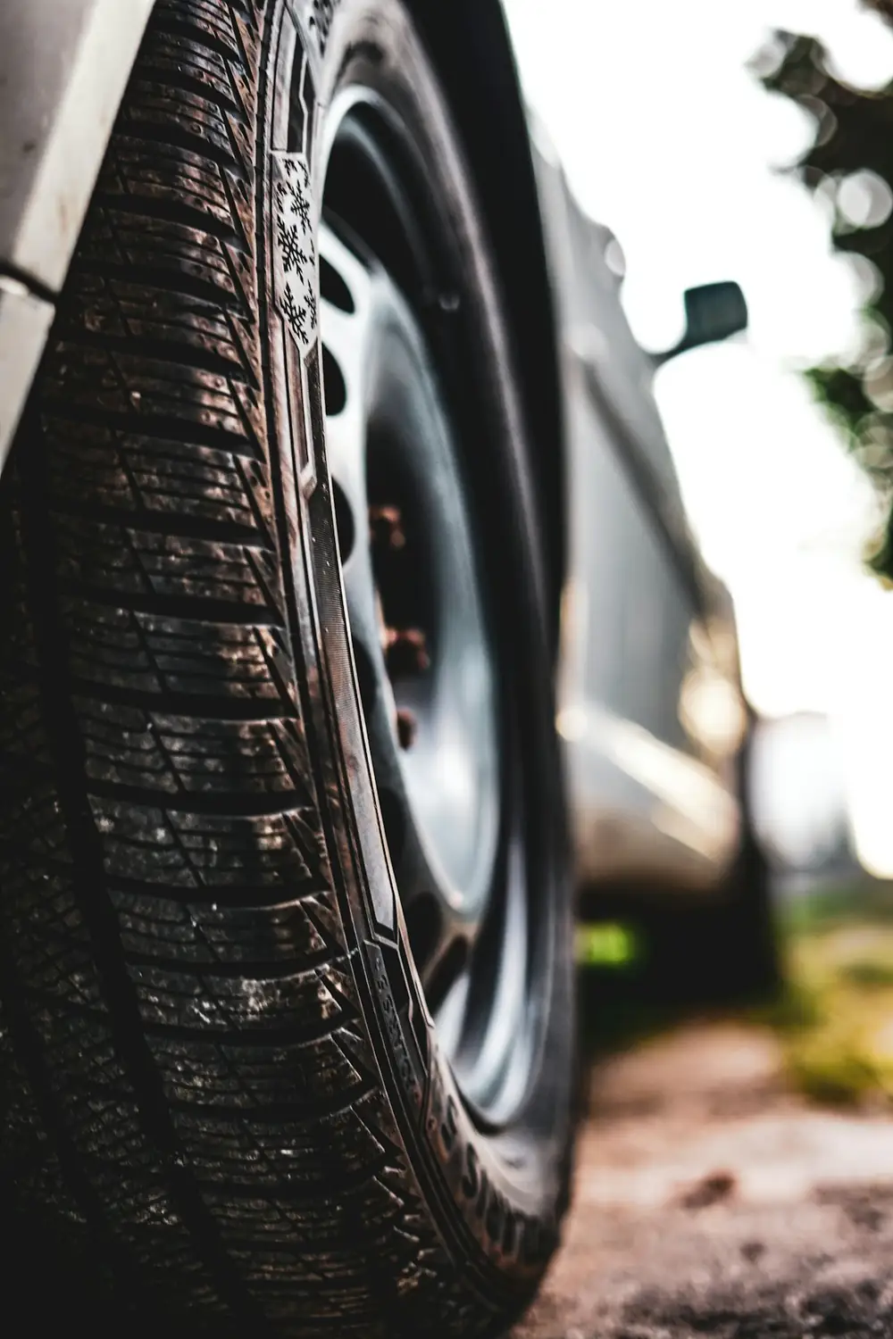 Low angle view of a car tire and wheel